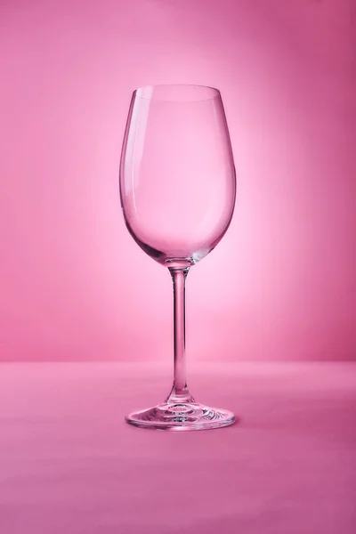 glass for wine on pink  background