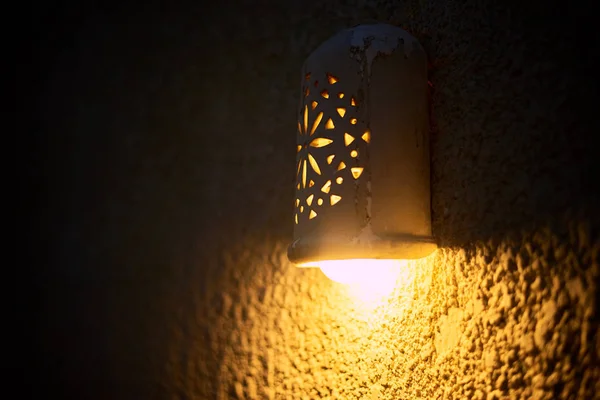 close up image of night lamp on wall