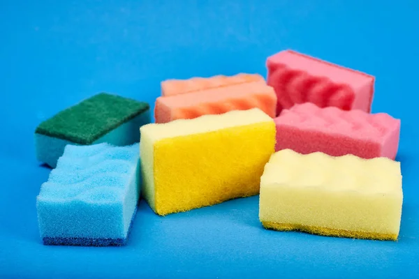 Washing Sponges Blue Background Royalty Free Stock Photos