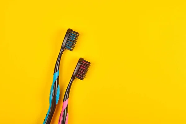 Close Shot Blue Pink Toothbrushes Yellow Dental Care Concept — Stock Photo, Image
