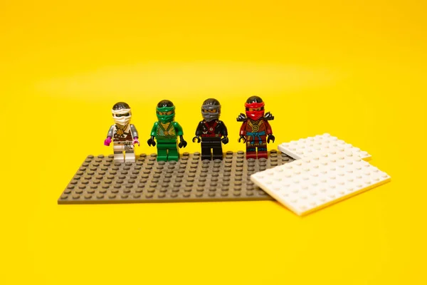 Small colorful toy heroes