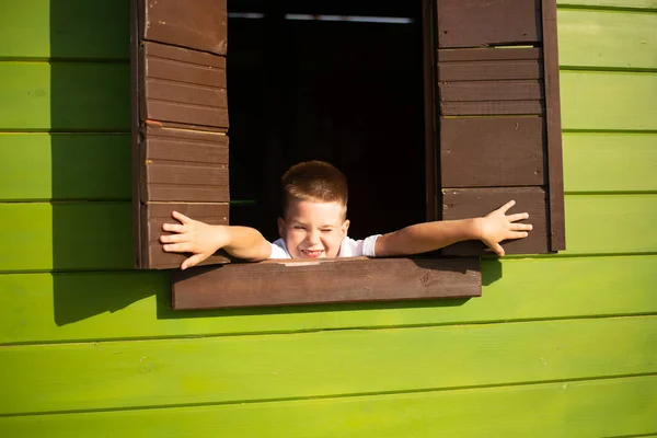 Happy Little Boy Wooden House Bright Shutters Royalty Free Stock Photos