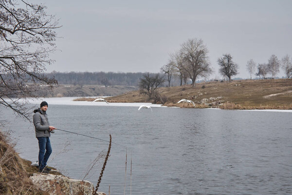 young man fishing at the river