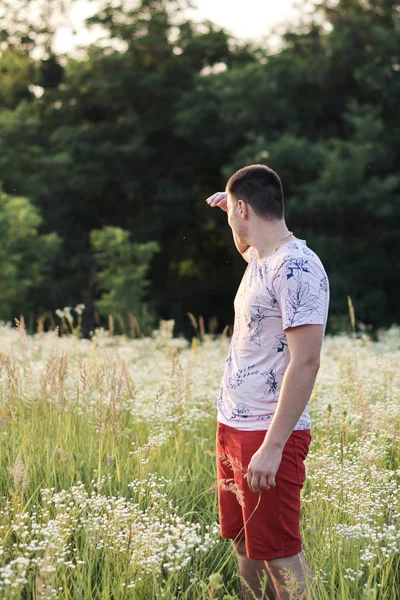 portrait of a young man in the field