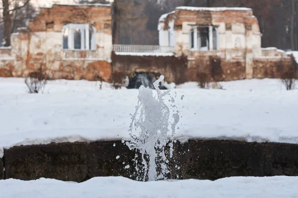 Small fountain splashing in winter park