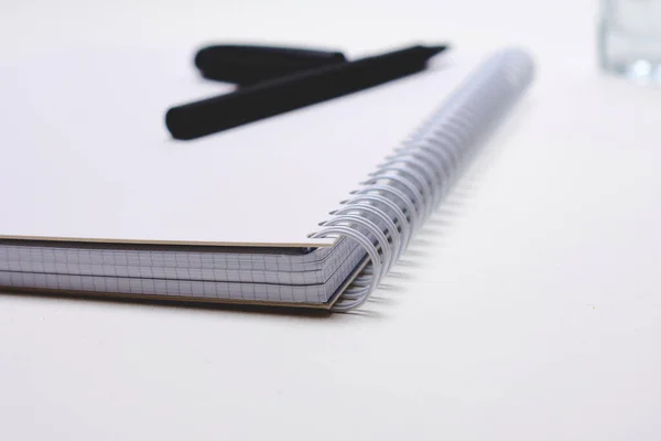 Notebook Pen Glass Water White Background — Stock Photo, Image