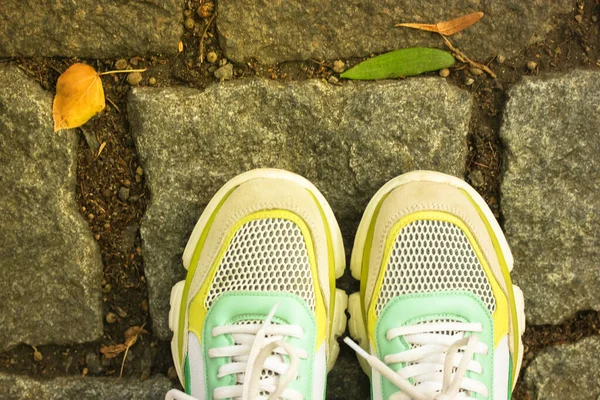 Bright Green Trendy Sneakers Background Paving Stones Asphalt Girl Jogging — Stock Photo, Image