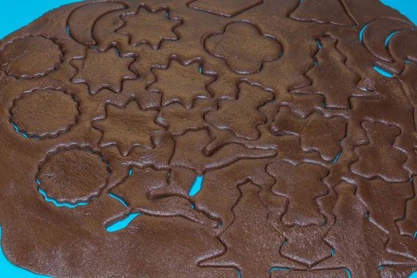 Raw Dough Being Punched Out Holiday Cookies Blue Underlay Preparing — Stock Photo, Image