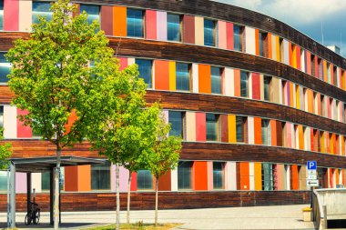 Environment and colorful facade of the Federal Environment Agency in Dessau clipart