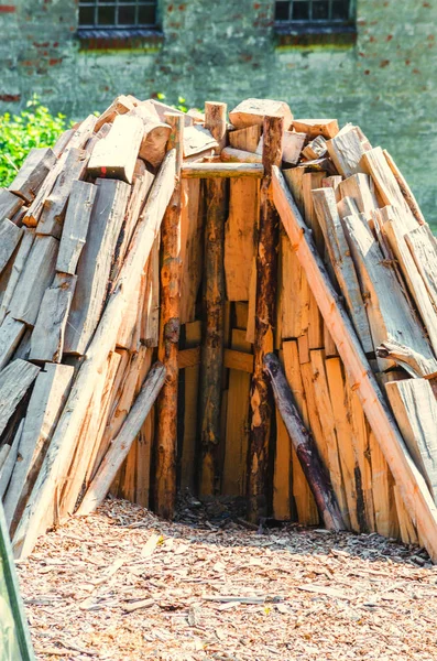 Conically stacked firewood for the production of charcoal a so-calle