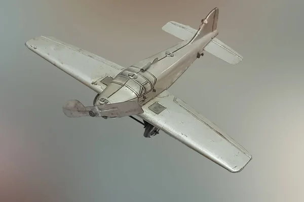 Picture of a retro gray metal toy airplane — Stock Photo, Image