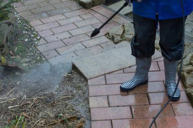 High pressure cleaning of the floor          clipart