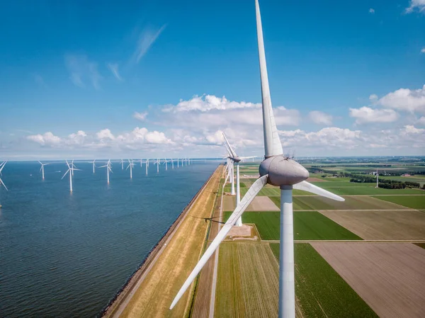 Windmill park westermeerdijk Netherlands, wind mill turbine with blue sky in ocean, green energy — Stock Photo, Image