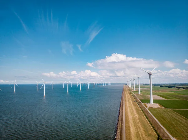 Windmill park westermeerdijk Netherlands, wind mill turbine with blue sky in ocean, green energy — Stock Photo, Image