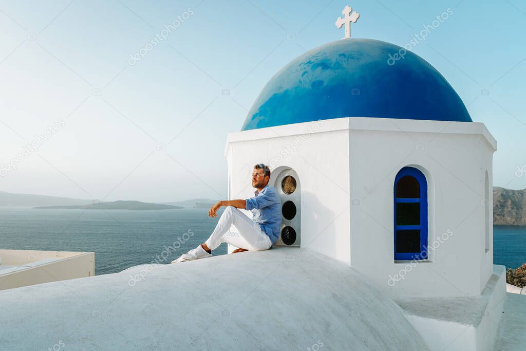 Santorini Greece, young men on vacation at the Island of Greece Santorini