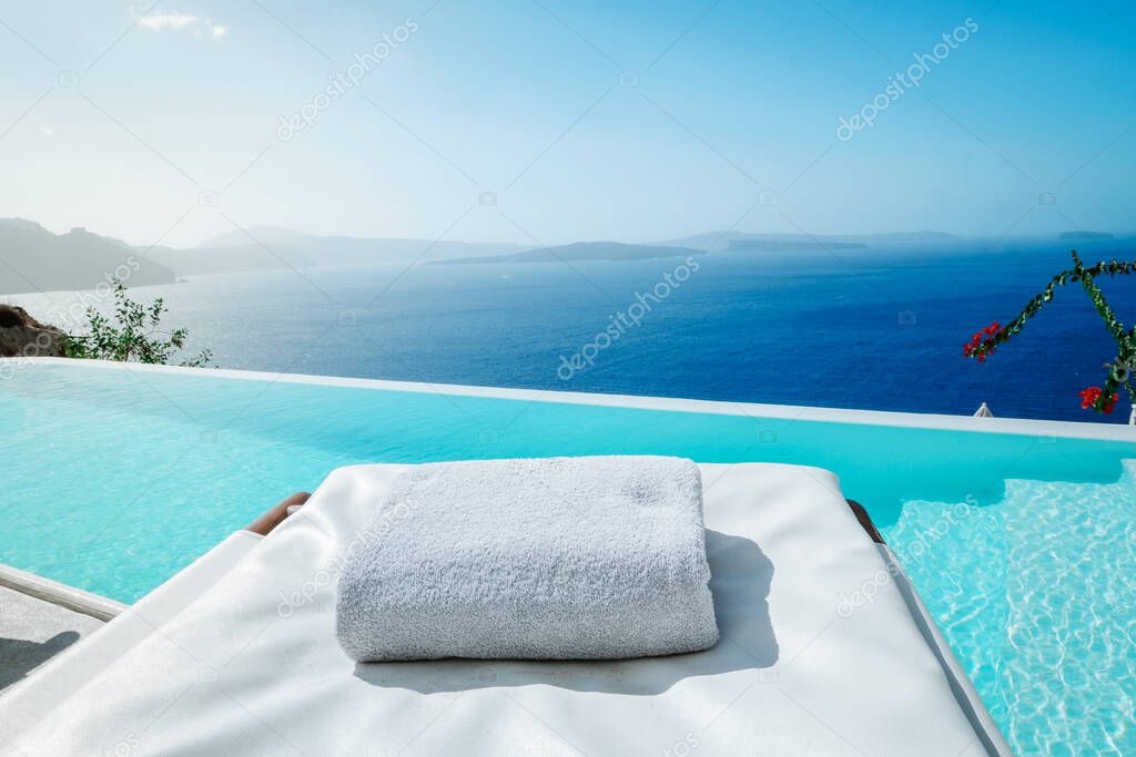 infinity pool Santorini Greece looking out over the caldera of the Greek Island, luxury vacation, swimming pool