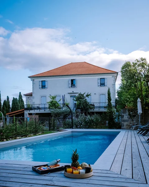 French vacation home with wooden deck and swimming pool in the Ardeche France