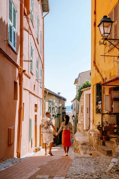 Menton France, couple men and woman on vacation at the Cote d Azur France, View on old part of Menton, Provence-Alpes-Cote dAzur, France — стоковое фото