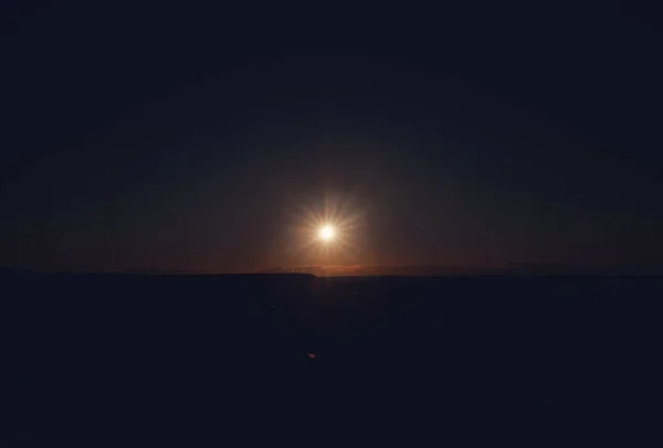 Sunset in warm colors and near some small clouds — Stock Photo, Image