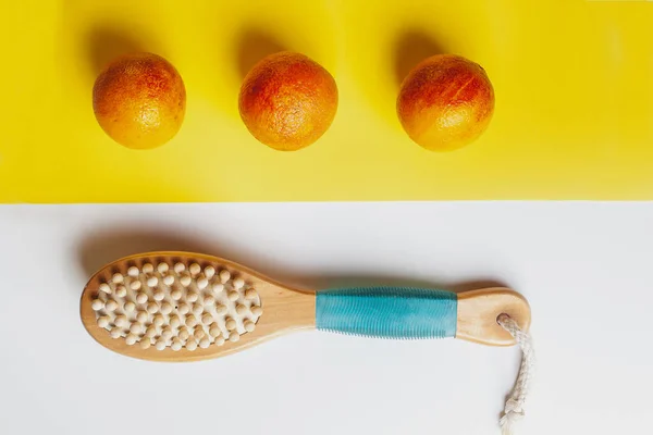 Anti-cellulite massage brush on a white background. Orange peel cellulite concept. Lymphatic drainage massage. Place for text. organic cactus brush