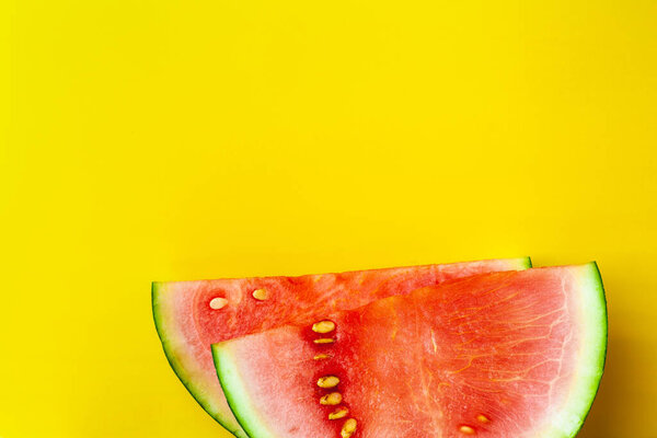 Slices of watermelon on a yellow background. Super food detox