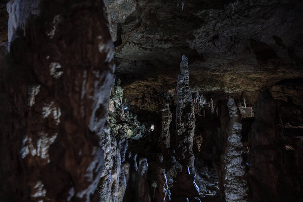 Inside the mysterious flowstone cave 'Nebelhoehle' with stalagmites and stalactites in Germany.