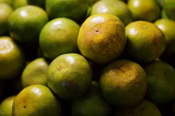 Orange fruit on greengrocery fruit shop