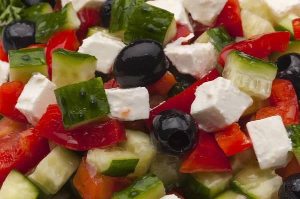 Greek salad served with olive oil close-up