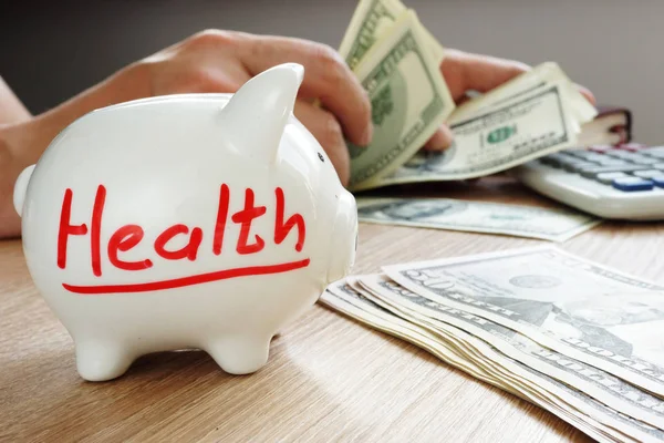 Health on a piggy bank. Savings for treatment. Medicine cost.