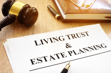 Living trust and estate planning form on a desk. clipart