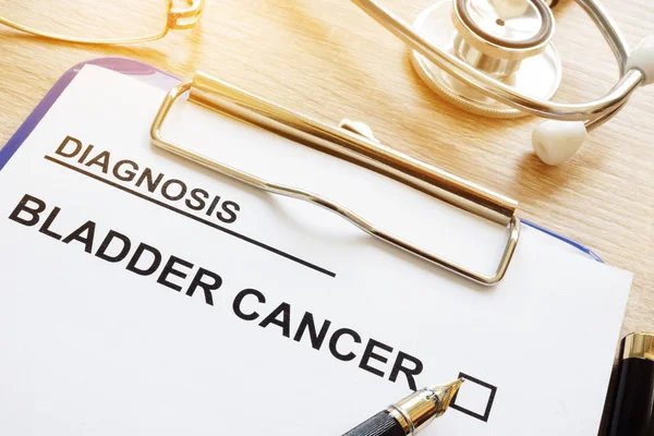 Diagnosis bladder cancer and pen on a desk.