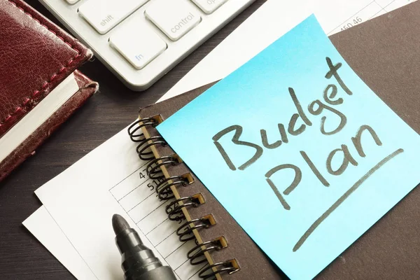 Budget Plan. Documents keyboard and note.