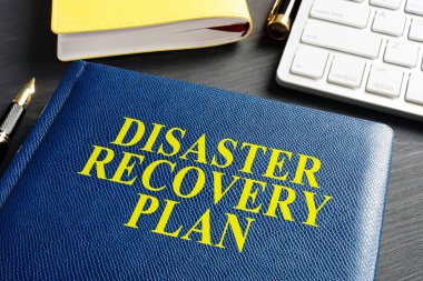 Disaster Recovery Plan on an office table. clipart