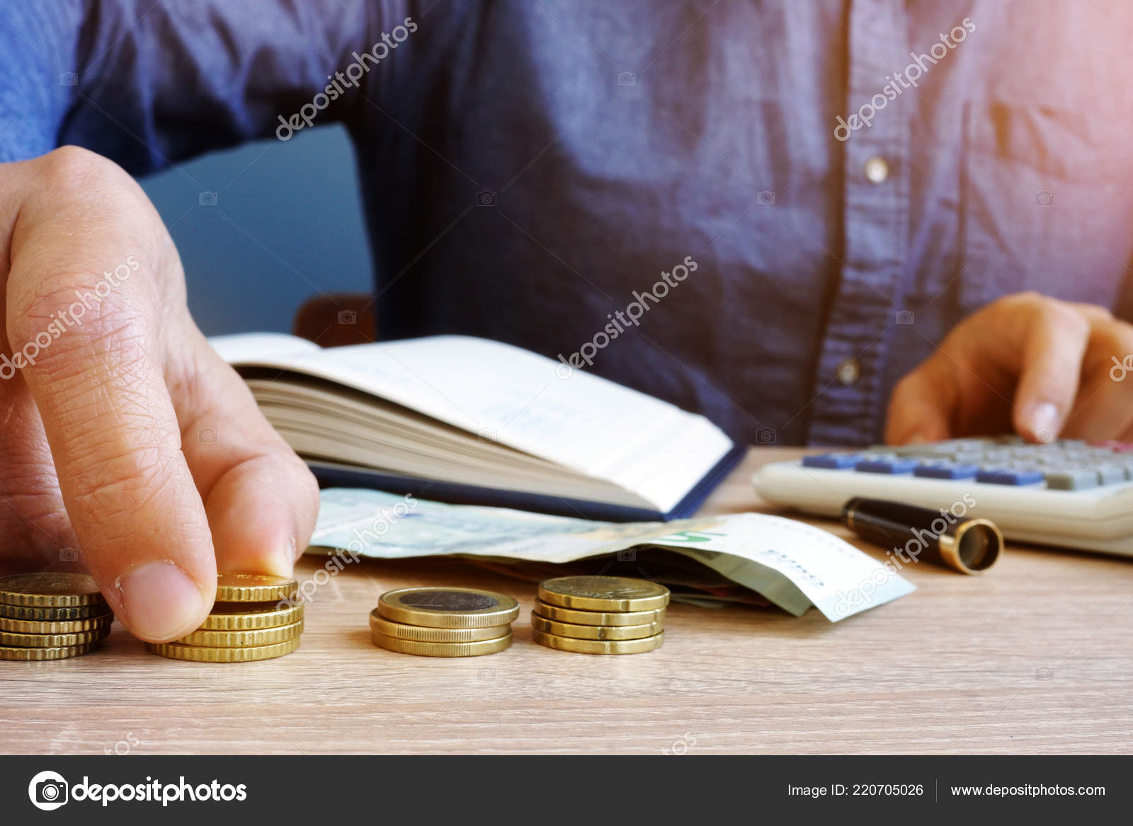 man counting euro coins home finances budgeting stock finances budgeting