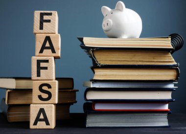 FAFSA Free application for federal student aid. Letters on the cubes. clipart