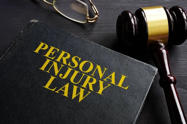 Personal Injury Law Book Black Desk — Stock Photo, Image