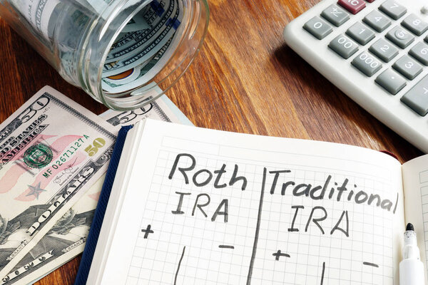 Roth IRA vs Traditional IRA written in the notepad.
