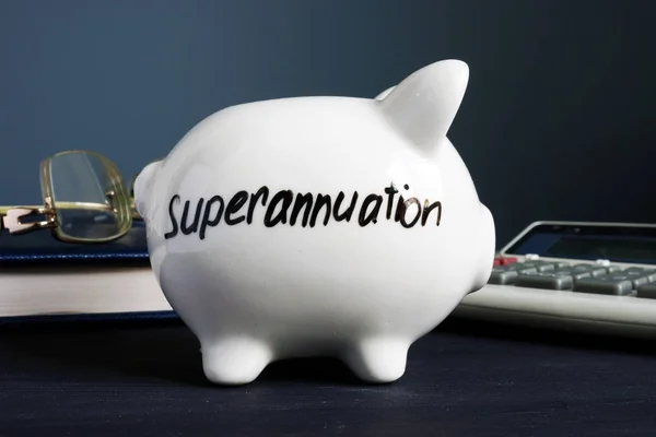 Superannuation Written White Piggy Bank — Stock Photo, Image