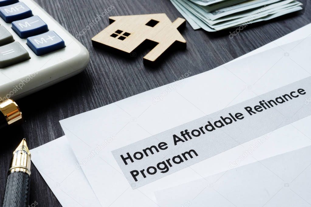 Home Affordable Refinance Program HARP papers on a desk.
