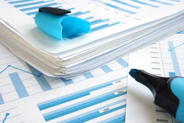 Planning business strategy. Stack of papers with financial graphs. — Stock Photo, Image