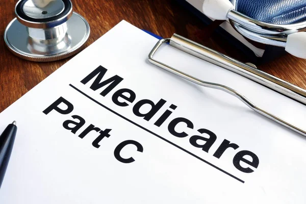 Medicare Part C papers, glasses and stethoscope. — Stock Photo, Image