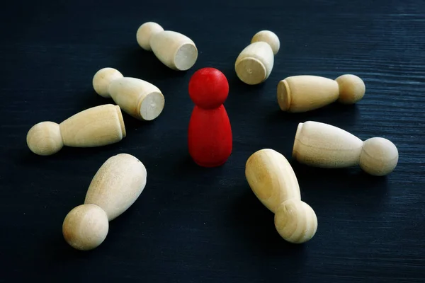 Success in business and leadership. Red figurine on a desk. — Stock fotografie