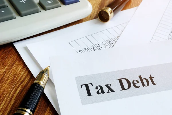 Documents about tax debt on a table. — Stock Photo, Image