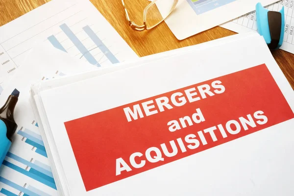 Mergers and Acquisitions M&A agreement and business papers. — Stock Photo, Image