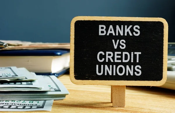 Banks vs Credit Unions concept. Money and ledger. — Stock Photo, Image