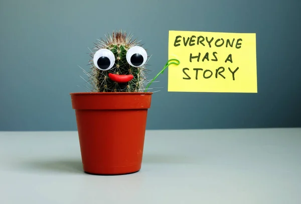 Cactus holding sign everyone has a story. — Stock Photo, Image