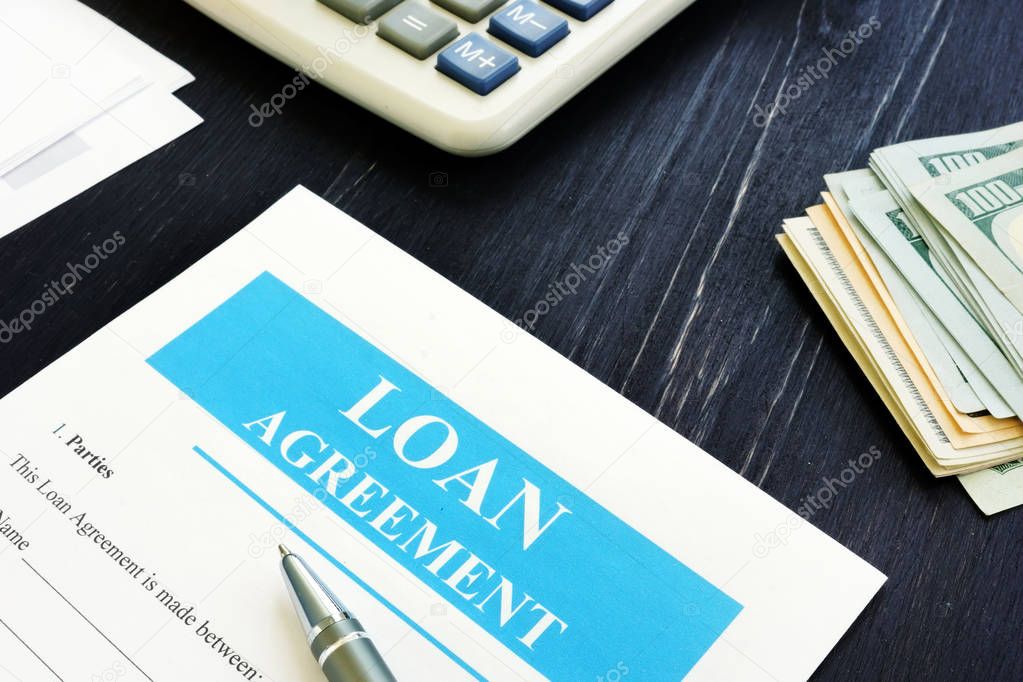 Loan Agreement form with cash and calculator.