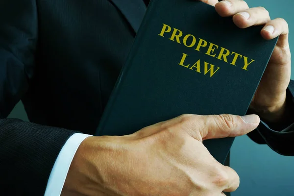 Property law in the hands of a lawyer. — Stock Photo, Image