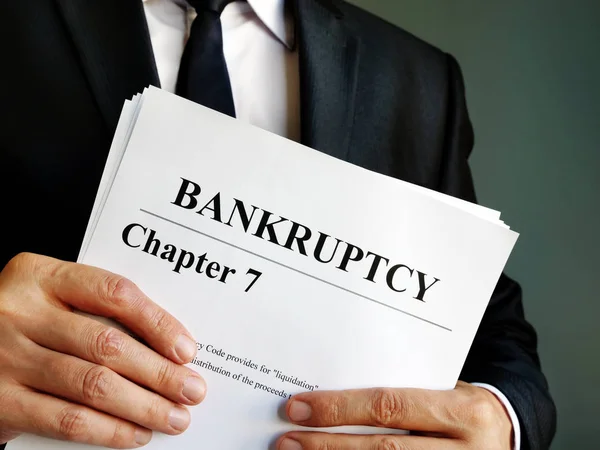 Bankruptcy Chapter 7 documents in the hands. — Stock Photo, Image