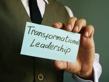 Transformational Leadership sign on a black page. clipart